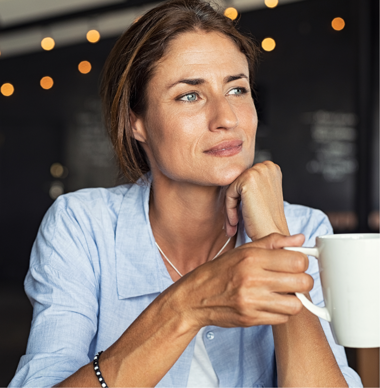 middle aged woman drinking coffee